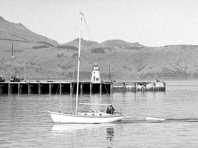 Lyttelton breakwater east light
in 2011 the two earthquakes partially collapsed the quay and left the lighthouse with a severe lean; the Port Corporation has a photo that shows this lean. Google's satellite view shows the pier after the lighthouse was removed for restoration. The pier was replaced by a new cruise ship pier while the lighthouse was removed to storage. The lighthouse returned when the new pier was completed in November 2020
Permission granted by [url=http://forum.shipspotting.com/index.php?action=profile;u=24874]Chris Howell[/url]
[url=http://shipspotting.com/gallery/photo.php?lid=1455040]Original photo[/url]
Captured:	May 22, 1977
Keywords: New Zealand;Pacific ocean;Lyttelton;Historic