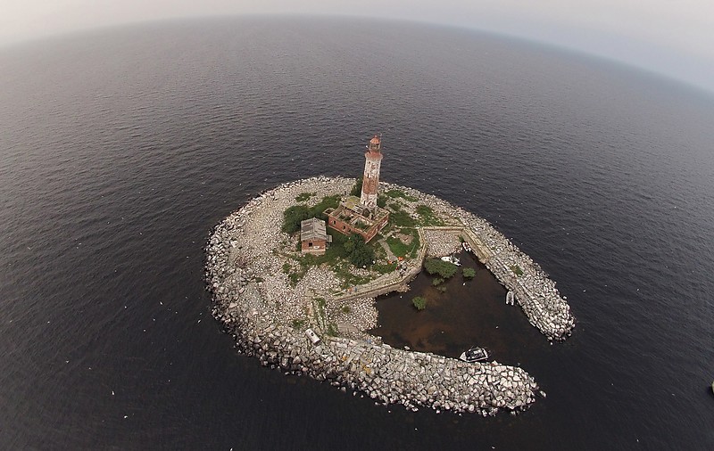 Ladoga lake / Sukho island lighthouse - aerial shot
Photo by Bair Irincheev
AKA Suho, Vironsaari
Island is artificial and created by order of the Peter I (the Great) after his ship ran aground on the shoal. The lighthouse was heavily damaged in an unsuccessful attack by German and Finnish marines on 21 October 1942.
Keywords: Russia;Ladoga lake;Aerial