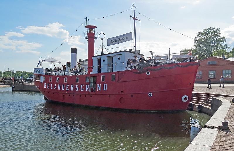 Helsinki / Relandersgrund lightship
Author of the photo: [url=https://www.flickr.com/photos/21475135@N05/]Karl Agre[/url]   
1888-1914 Relandersgrund station
July 1914 	during WWI withdrawn from Relandersgrund station and sent to Rauma. Russian seamen, wildly celebrating their revolution, sailed it to the southern shore of the Gulf of Finland and sank it
1918 the lightship was raised, repaired in Tallin, brought to Helsinki and converted into a reserve lightship
1918-1937 reserve lightship "RESERV I" 
1937 decommissioned 
1938-1978 expedition vessel "VUOLLE"
1978 sold for scrap                
Keywords: Helsinki;Finland;Gulf of Finland;Lightship