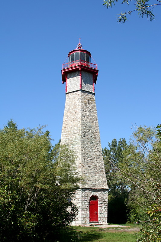 Toronto - Gibraltar Point Lighthouse
The lighthouse at Gibraltar Point is the city's earliest landmark and one of the oldest surviving buildings in Toronto.  Built around 1808 the lighthouse originally operated as a fixed white light by burning sperm whale oil.  From 1863 coal oil was used, and in 1872 a revolving mechanism was installed so that the light rotated once every minute and 48 seconds.  Electric lighting was first used around 1916, and the current lighting system was installed in 1945. 

The lighthouse was originally built at the water's edge but over time sand has built up so that it now stands some distance inland.  In 1958 the building was transferred to the city's parks department and no longer operates as a lighthouse.
Keywords: Toronto;Canada;Lake Ontario