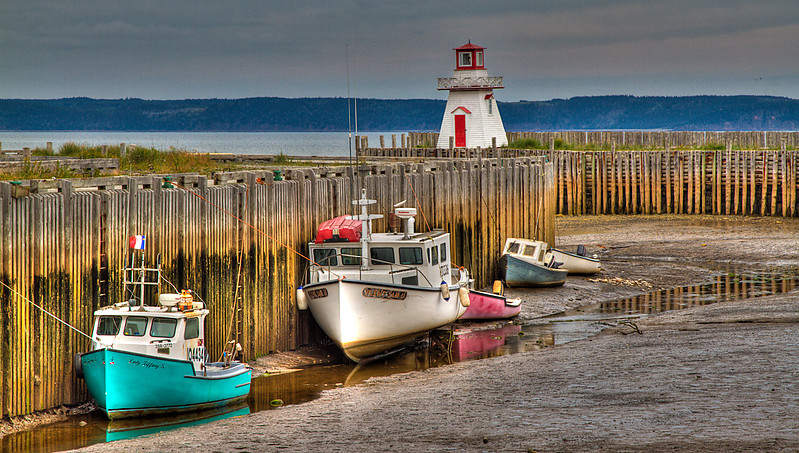Nova Scotia / Belliveau Cove Lighthouse
In operation as a private navigational aid, the Belliveau Cove Lighthouse safely guides marine traffic through the drastically changing tides of St. Mary's Bay.
Author of the photo: [url=https://www.flickr.com/photos/jcrowe/sets/72157625040105310]Jordan Crowe[/url], (Creative Commons photo)

Keywords: Nova Scotia;Canada;Bay of Fundy