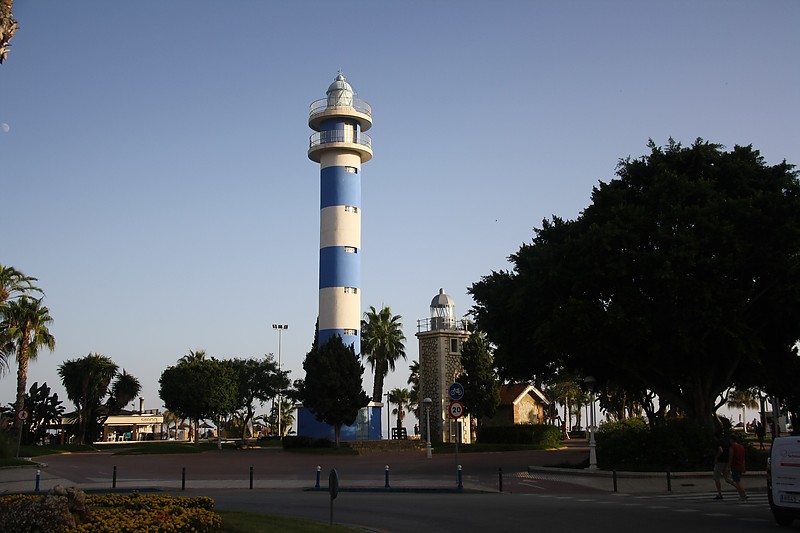 Andalusia / Torre del Mar lighthouses
High - new
Low - old, built 1969 Inactive since 1974, ~10m high tower 
According to Russ Rowlett:
The original lighthouse, built at the mouth of the R?�o V?�lez, collapsed in 1880 due to beach erosion both by the ocean and the river. It was replaced by a "temporary" wood tower, which served until an 11 m (36 ft) masonry replacement tower was finally built in 1930. By the late 1960s, rapid beachfront development had rendered that lighthouse useless, so this tower was built near the ocean beach as a stopgap measure. 
Keywords: Torre del Mar;Spain;Andalusia;Mediterranean sea