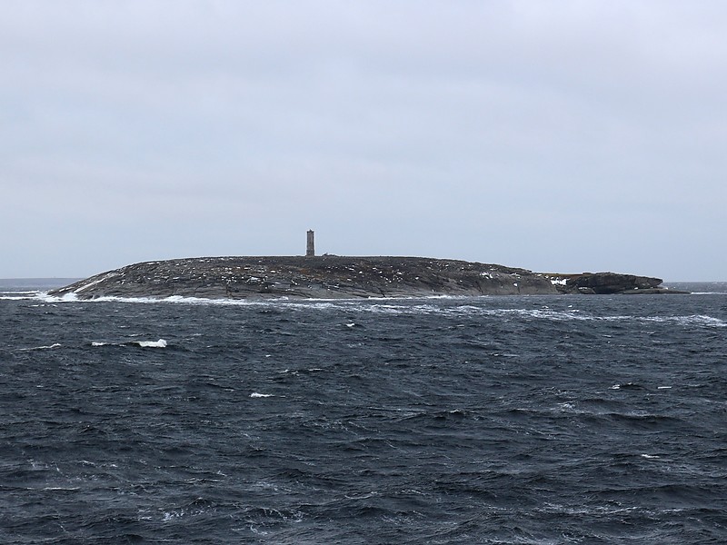 Kara sea / Belukha island lighthouse
Constructed in memory of crew of the USSR icebreaker Sibiryakov. On August 25, 1942 she was sunk after an unequal fight with Kriegsmarine heavy cruiser Admiral Scheer about 10 miles north the island. Sibiryakov was armed only with several 76-mm and 45-mm guns and was no match for the pocket battleship with 280-mm main guns. However radio transmission from A. Sibiryakov before and during 1-hour battle alerted east and west bound Russian convoys, allowing them to avoid the area. Most crew and civilians died in battle or went down with the ship. 22 were captured by the Germans. Only one sailor reached Beluha island and was picked up 35 days later. In total only 15 crew members survived the war.
Author of the photo: [url=http://polarpost.ru/forum/viewtopic.php?f=36&t=6019]Sergey Shulinin[/url]
Keywords: Kara sea;Russia;Taymyr Peninsula