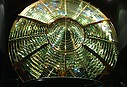 Fresnel_lens_from_White_Shoal_Light_is_on_display_at_Whitefish_Point_Light_near_Paradise2C_Michigan.jpg