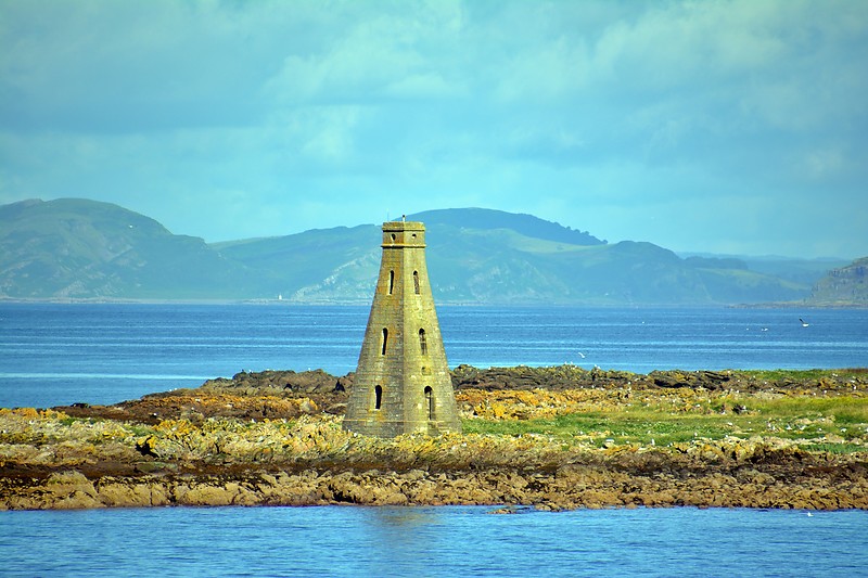 Horse Isle Beacon
A 52 foot tall stone beacon stands at the south end of Horse Isle marking the island for shipping. Erected in 1811, it was commissioned by Hugh, 12th Earl of Eglinton on the suggestion of John Ross. Located just off Ardrossan Harbour. It is indicated only by the word "landmark" on the Ordnance Survey map.
Keywords: Firth of Clyde;Scotland;United Kingdom;Ardrossan