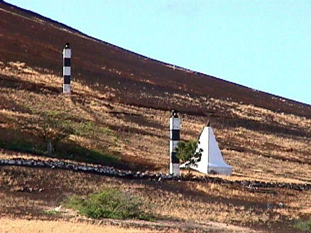 Ascension Island / Georgetown / Redpole Monument (Pyramid) with Leading Light front & (above) Rear.
The Redpole monument marks the grave of Captain Paisley of the Brig HMS Redpole, who died in 1820.
The 2 lights should be seen (from the sea) in line over the Georgtown Landing Pier.
Keywords: Ascension;Atlantic ocean;United Kingdom
