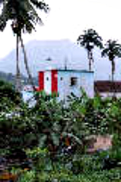 Gulf of Guinea / Principe / Santo António / Farolim de Santo António
The light is located on top of the red/white/red part of the harbourmasters building.
I'm sorry for the very poor quality.
Keywords: Sao Tome and Principe;Principe;Santo Antonio;Gulf of Guinea