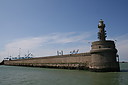Port_of_Zeebrugge2Cthe_Leopold_II_dam28build_190529_and_lighthouse_Now_a_classified_monument_~0.JPG