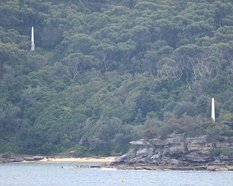 Sydney Harbour (Port Jackson) Obelisk Bay 
2 sandstone Obelisks, 9 metres high, painted white, used as day leads.

The alignment (274deg.)of the two obelisks (White both 9m high) standing on the north side of Obelisk Bay clears close north of South Reef . 
Keywords: Australia;Sydney Harbour;Port Jackson