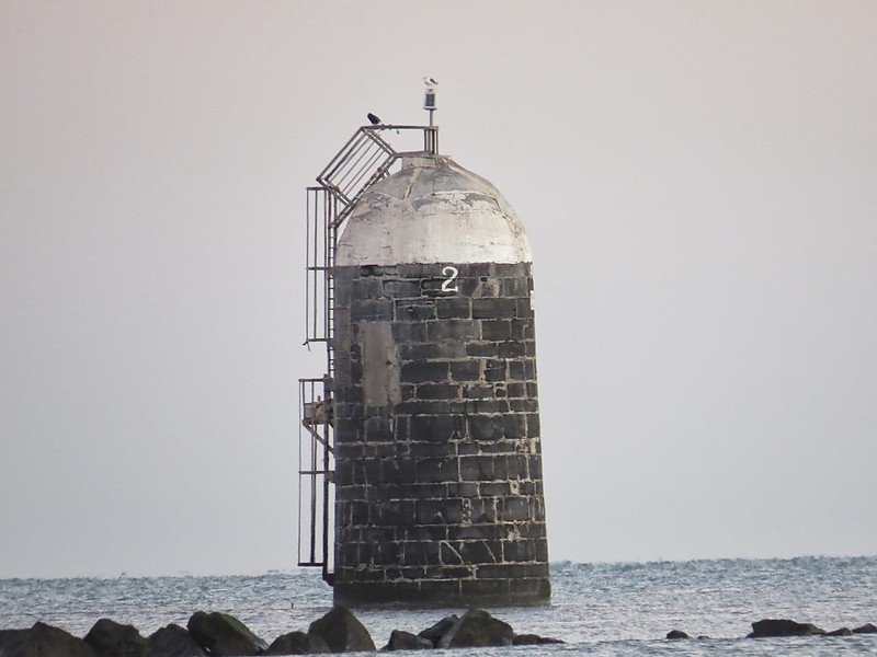 Aleria Lighthouse, co. Louth
Situated at the northern entrance of the mouth of the River Boyne, this comparatively modern light marks the dangerous approach to the port of Drogheda. It sits at the end of a rough wall of boulders that is submerged at high tide
Keywords: Ireland;Irish Sea;Boyne